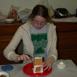 Sarah McGraw focuses on her ginger bread house.